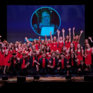 Whole cast photo on stage after dress run